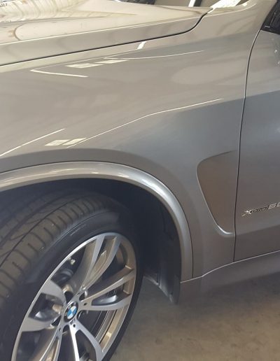 Refinished exterior on BMW X5 with ceramic coating and paint correction.