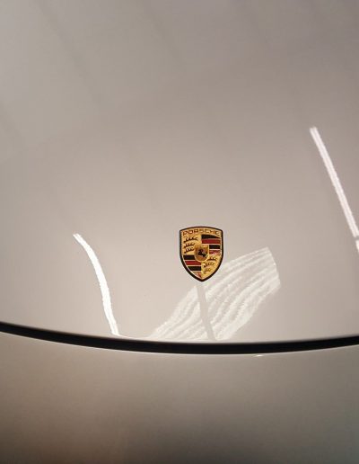 Photo of front of Porsche with ceramic coating applied.