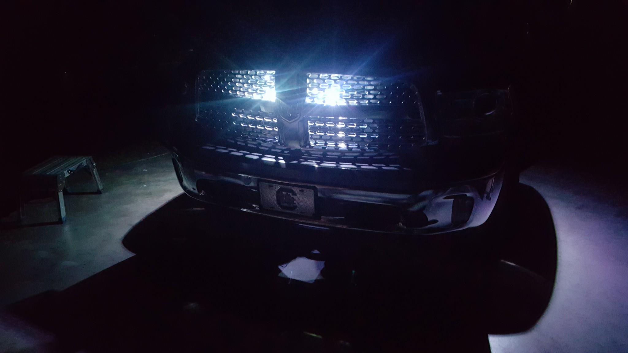 Photo of LED lights installed behind the grille of a Dodge Ram.