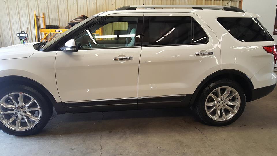White SUV shining after detailing service.