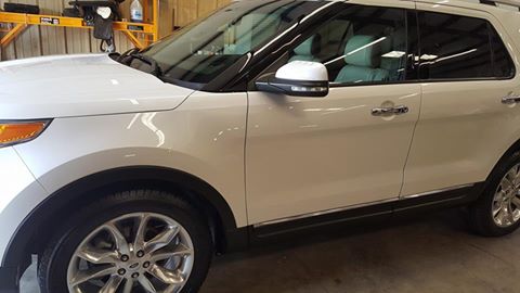 White SUV shining after detailing service.